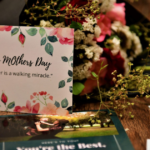 Thoughtful gifts for mothers including a cozy blanket, personalized jewelry, and self-care products.